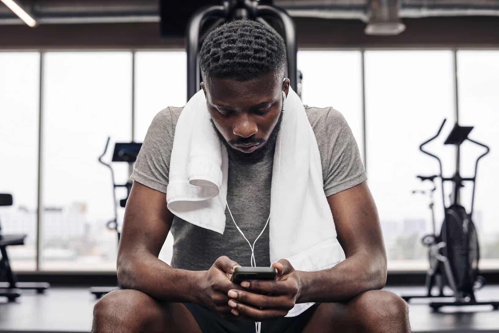 Athlete checking phone